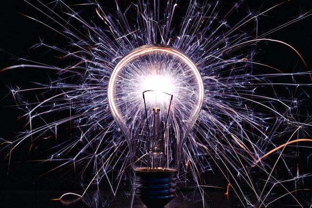 A lightbulb emitting many sparks